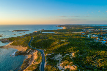 Wall Mural - Bowman scenic drive passing along beautiful ocean coastline of Beachport, South Australia at sunset - aerial view