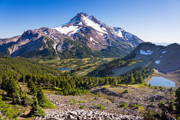 Wall Mural - a high elevation volcanic peak seen in daylight in the summer with little snow and ice remaining on 