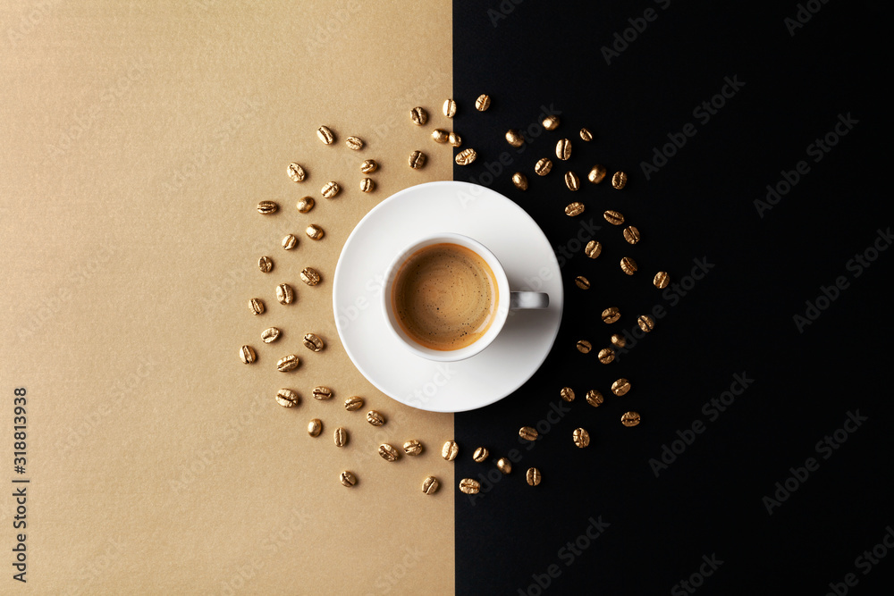 Obraz na płótnie Cup of coffee and coffee beans on gold black background. Creative flat lay. Top view. w salonie