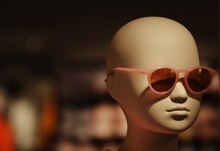 Close-Up Of Mannequin Wearing Sunglasses In Store