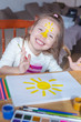 © Angelina - little girl paints the yellow sun