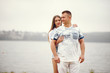© hetmanstock2 - Cute couple walking near water. Girl in a white shirt. Pair by the river