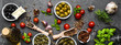 Mediterranean food background with herbs, olive, oil, tomatoes, basil