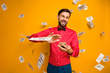 Photo of crazy funny guy hold fan of money bucks waste jackpot throw away banknotes money falling wear trendy red shirt bow tie clothes isolated yellow color background
