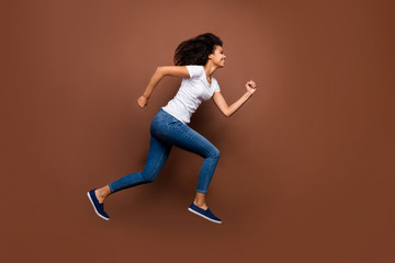 Sticker - Full body profile photo of crazy funny dark skin lady jumping high sportive competitions participant rushing finish wear white t-shirt jeans isolated brown color background