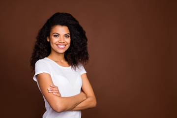 Poster - Turned photo of positive content afro american girl feel friendly emotion cross hands enjoy weekends wear casual style outfit isolated over brown color background