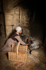 Wall Mural - Old Master portrait of woman at fireplace