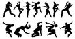 A set of men and women street dance hip hop dancers in silhouette