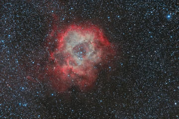 Wall Mural - abstract background with space image. cosmic nebulae, stars glow in space in red. photo with a long 