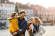 © pikselstock - Happy young family having fun outdoors during Christmas