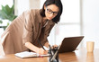 © Prostock-studio - Portrait of manager taking notes standing at table