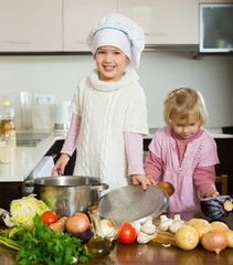 Wall Mural - Children cooking in kitchen