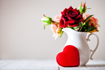 Wall Mural - greeting card with flowers and heart. background with copy space. selective focus.