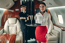 Pilot And Flight Attendant In Private Jet