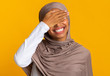 © Prostock-studio - Facepalm. Cheerful Black Muslim Woman In Headscarf Covering Eyes With Hand