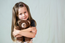 Pretty Child Girl Playing With Her Teddy Bear Toy.
