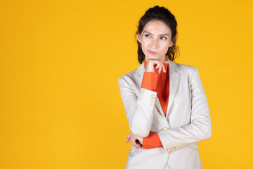 Portrait of business woman on yellow background