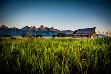 Sunrise With Mountains And Old Barn
