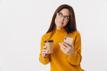 Sticker - Image of beautiful brunette adult woman holding coffee cup and cellphone