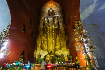 A large Buddha statue in the ancient pagoda in Bagan, Myanmar