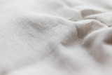 Natural linen fabric texture. Rough crumpled burlap background. Selective focus. Closeup view