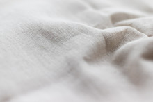 Natural Linen Fabric Texture. Rough Crumpled Burlap Background. Selective Focus. Closeup View