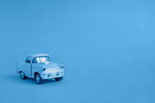 Blue Toy Car On The Road On A Classic Blue Color Background 