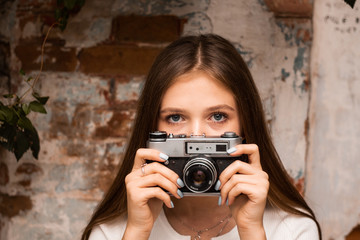 girl photographer walks around the city. urban tourism concept,