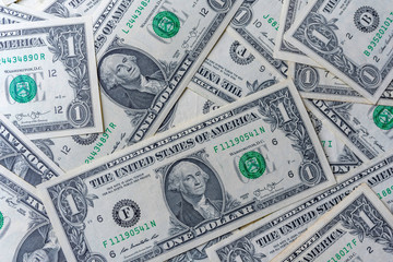 Background from one dollar banknotes. Photographed close-up.