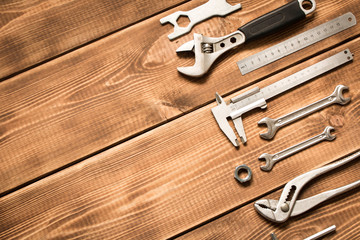 Wall Mural - Labor day. Various tools on a wooden background. The concept of labor day. Empty space for text.