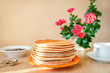 Real food. Pancakes on the table with home flower. Authentic breakfast