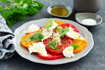 Wall Mural - salad of tomato, mozzarella and basil. Italian food.