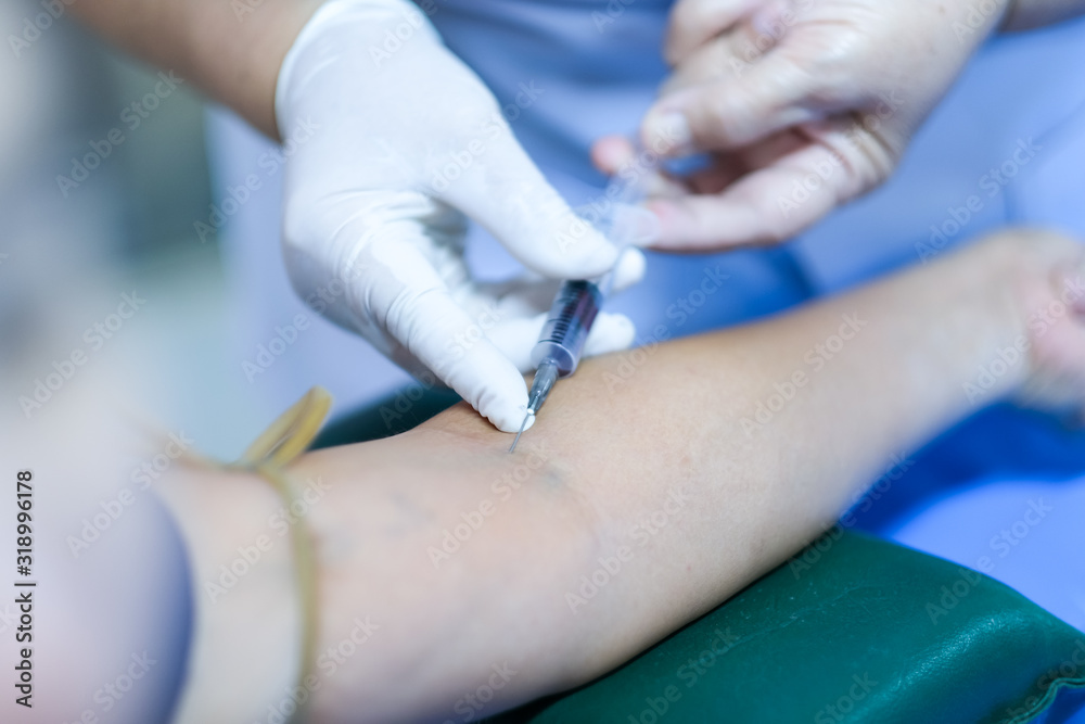 The process of a blood test for a woman's health check in the hospital ...