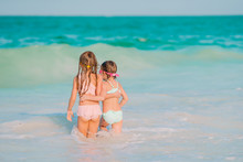 Kids Have A Lot Of Fun At Tropical Beach Playing Together