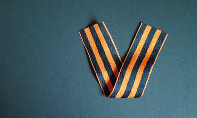 Saint George ribbon in the form of a letter V - Victory. Concept on the theme of victory in the Great Patriotic War