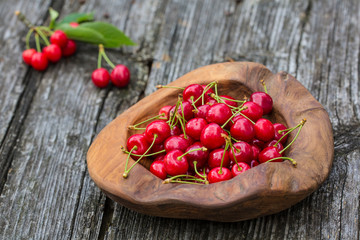 Ripe summer fruits, cherry on a wooden table, rustic background