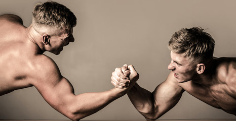 Poster - Arm wrestling. Two men arm wrestling. Men measuring forces, arms. Hand wrestling, compete. Rivalry, closeup of male arm wrestling. Hands or arms of man. Muscular hand