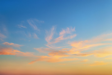 Wall Mural - golden sunset clouds in a clear blue sky. scenic dusk skyscape. twilight paradise sky. calm heaven b