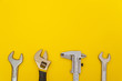 © Виталий Борковский - Necessary set of tools for plumbers on yellow background
