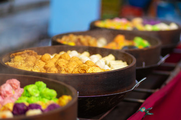 Colorful steamed dim sum, chinese dumpling in a wooden steamer. at Jalan Alor night market, Kuala Lumpur, Malaysia