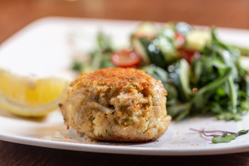 crabcake dinner on plate in restaurant