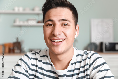 Fotografía Young man using video chat at home