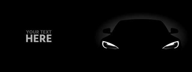 Black electric car  in the dark.	