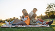 © Svitlana - Modern world. Happy family spending time in the park on a sunny day
