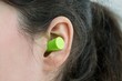 © Tunatura - Woman's ear with an ear plug, noice  reduce, noice pollution .