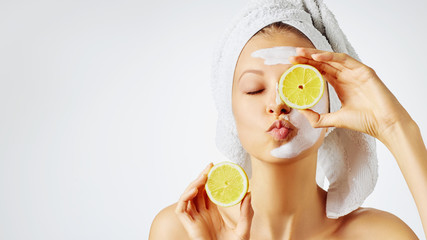 Wall Mural - cosmetology, skin care, face treatment, spa and natural beauty concept. woman with facial mask holds