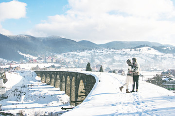 a pair of lovers on a winter walk. winter love story.