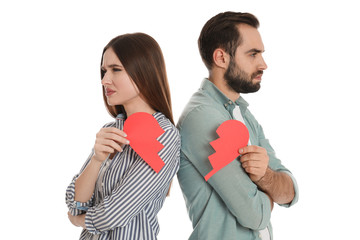 Wall Mural - Couple with torn paper heart on white background. Relationship problems