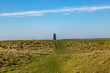 A trig point on Firle Beacon in the South Downs, on a sunny winters day