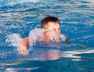 young man bathes in pool